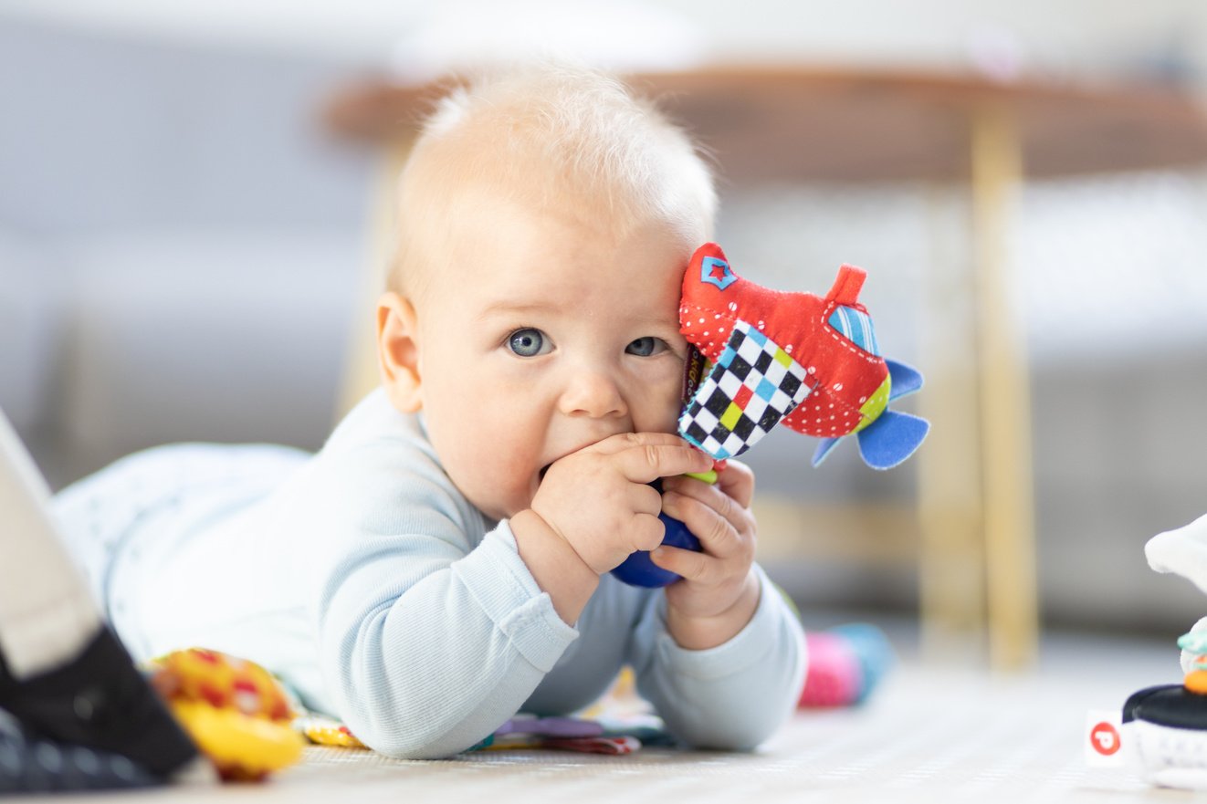 Cute Baby Boy Playing with Hanging Toys Arch on Mat at Home Baby Activity and Play Center for Early Infant Development. Baby Playing at Home