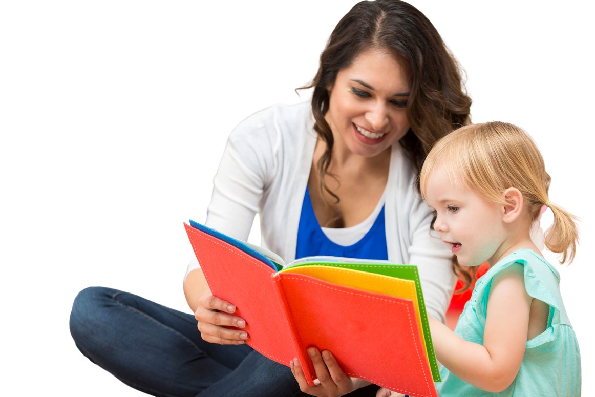 Hispanic preschool teacher reading a book to cute toddler girl